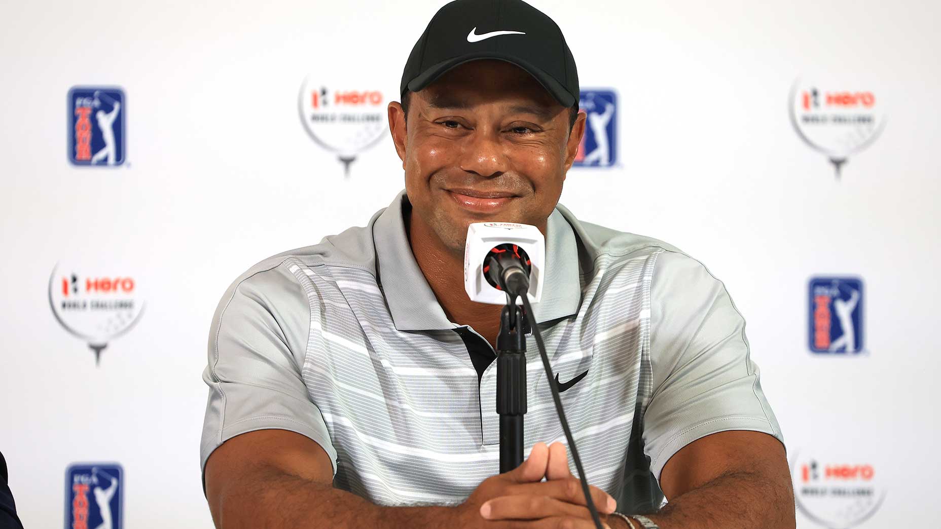 Tiger Woods smiles during a press conference at the Hero World Challenge on Tuesday.