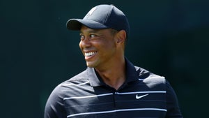 tiger woods smiling at the 2023 masters