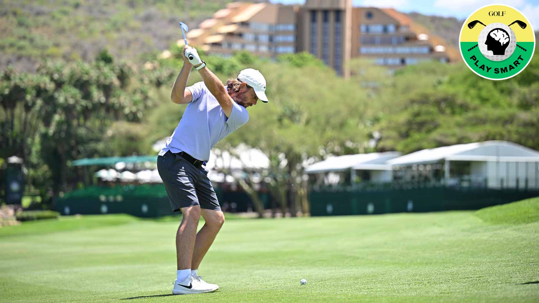 tommy fleetwood hits an iron from the fairway during the 2022 Nedbank Golf Challenge