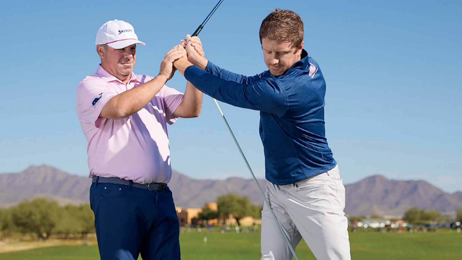 tony ruggiero shows a student how to stretch out their backswing