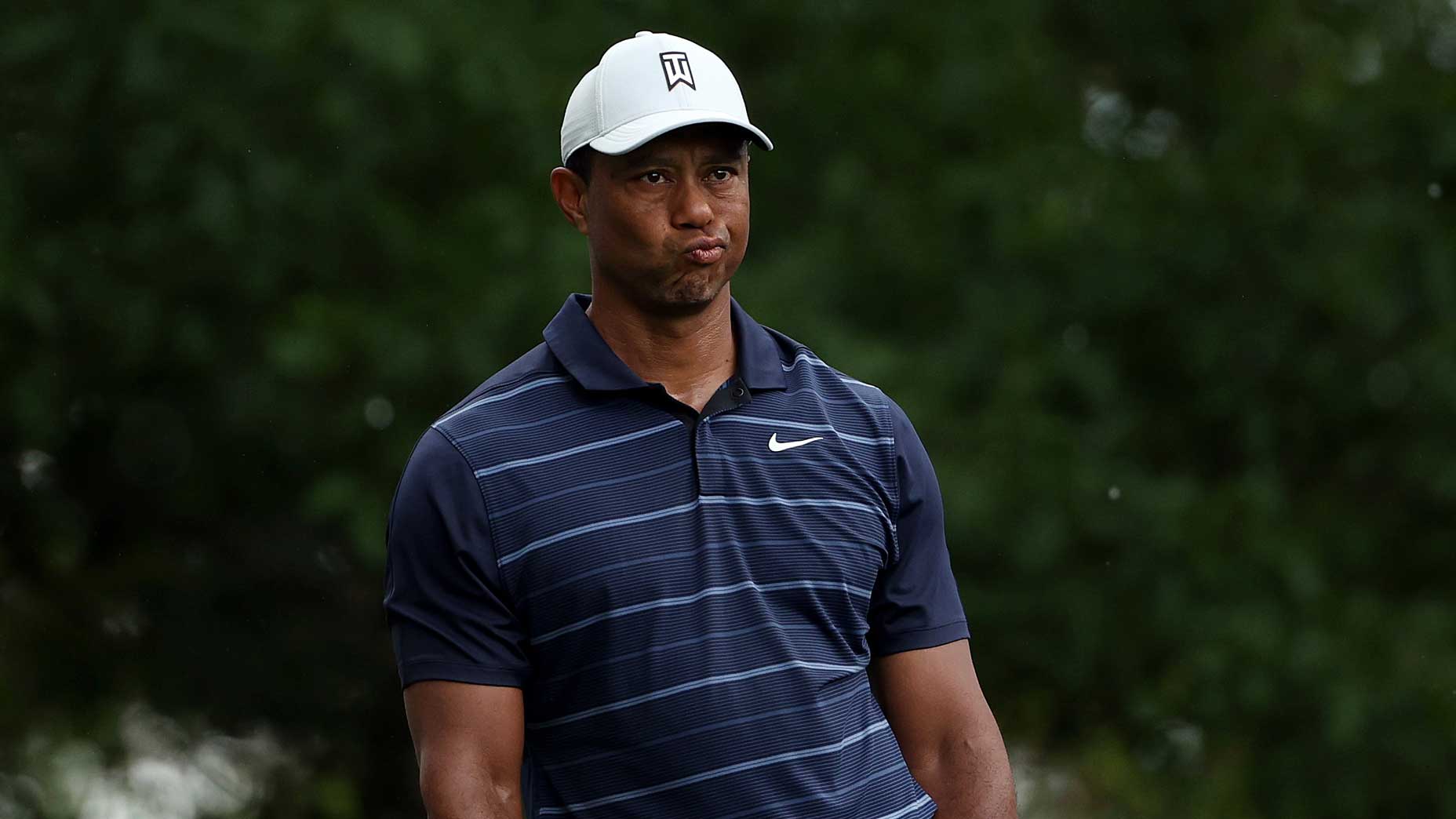 Tiger Woods looks at the camera during the Masters tournament