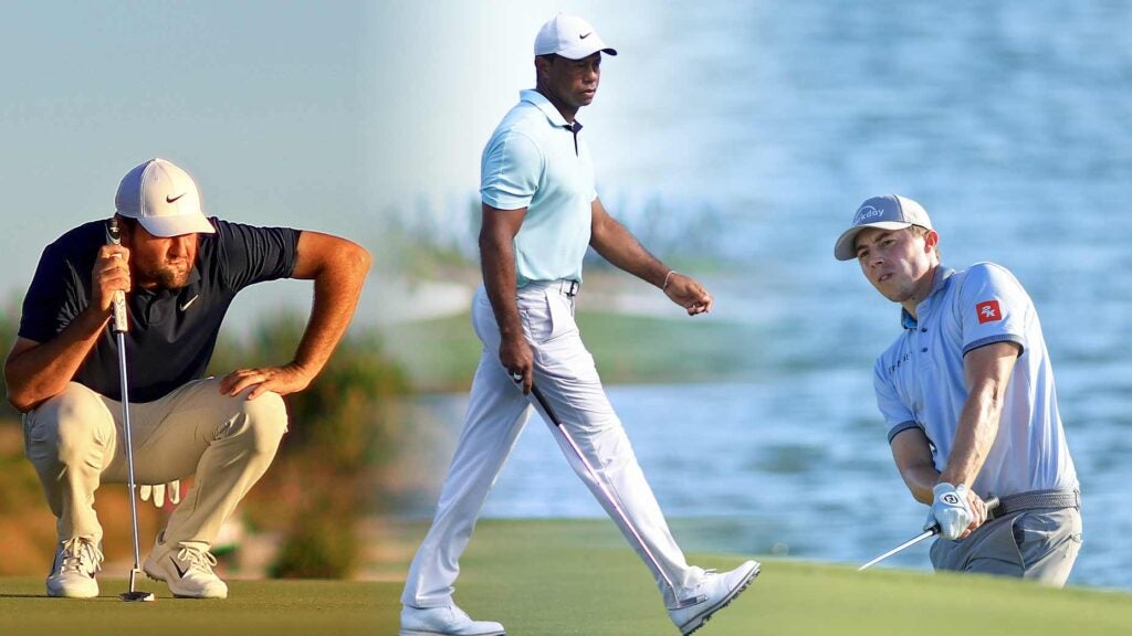 Tiger Woods walks between pictures of Scottie Scheffler and Matt Fitzpatrick.