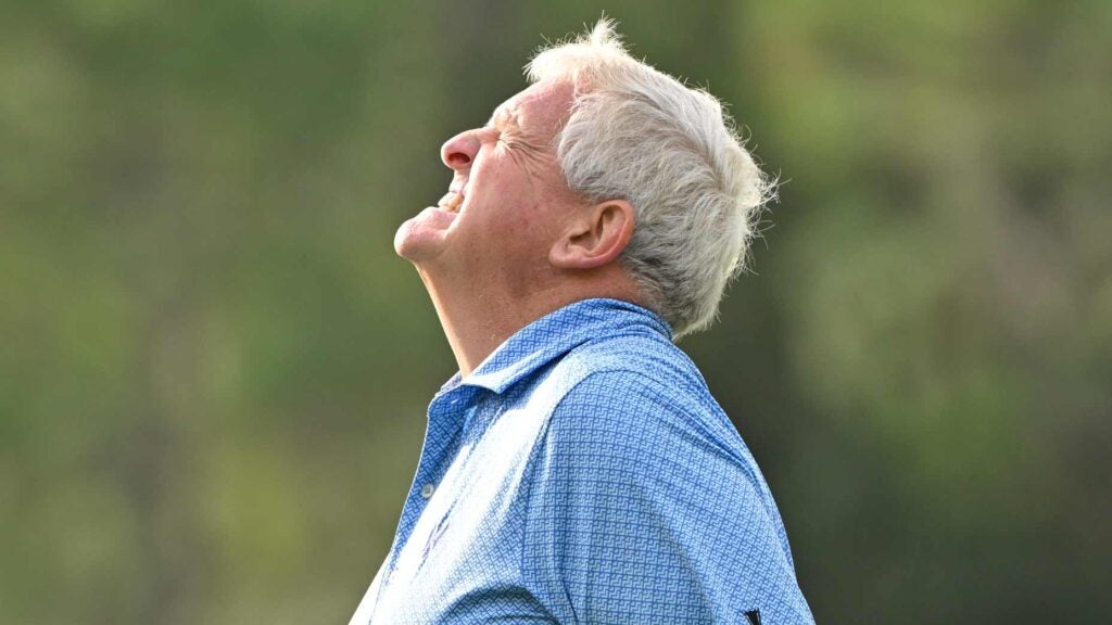 Colin Montgomerie grimaces after missing a putt.