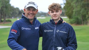 Padraig Harrington of Ireland and his son Ciaran Harrington of Ireland pose for a photograph on the first tee during the Friday pro-am as a preview for the PNC Championship at The Ritz-Carlton Golf Club on December 15, 2023 in Orlando, Florida