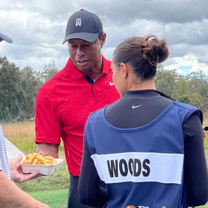 Tiger reaches for his lunch at the PNC Championship