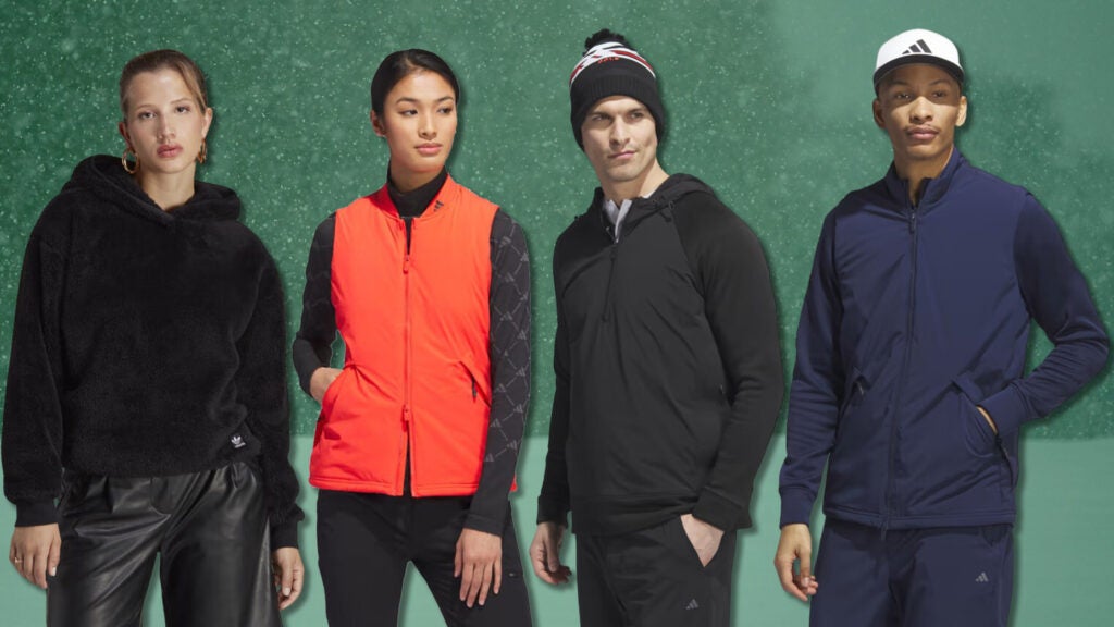 4 people (2 women, 2 men) modeling Adidas clothing. 1st woman is wearing a fluffy black fleece hoodie. 2nd woman is wearing an orange vest. 1st man is wearing a beanie and a black jacket with hood. 2nd man is wearing an adidas hat and navy jacket.