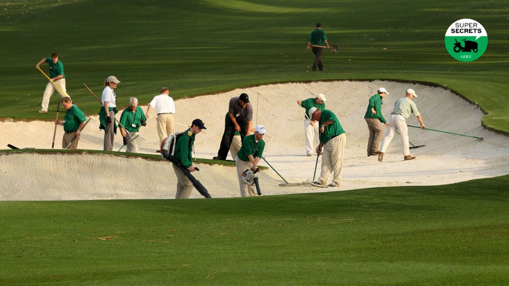 Grounds crew workers at Augusta National tending to a bunker