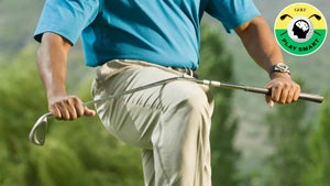 golfer breaks golf club over his knee
