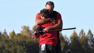 charlie woods and tiger woods hugging at the 2022 PNC Championship