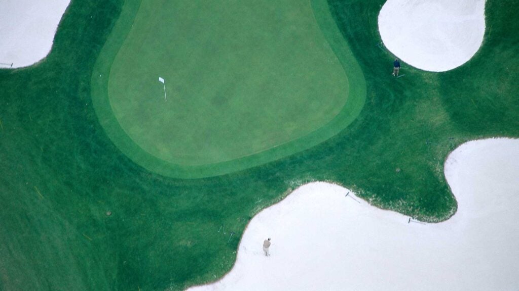 a green surrounded by bunkers