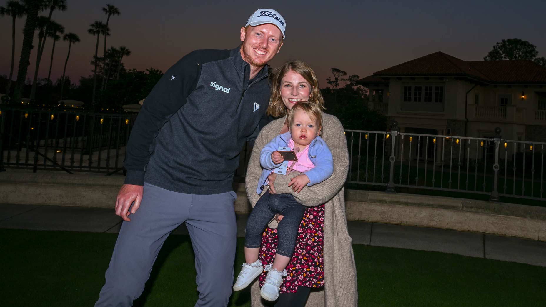 Hayden Springer poses for family photos after earning his PGA Tour card at Q-School