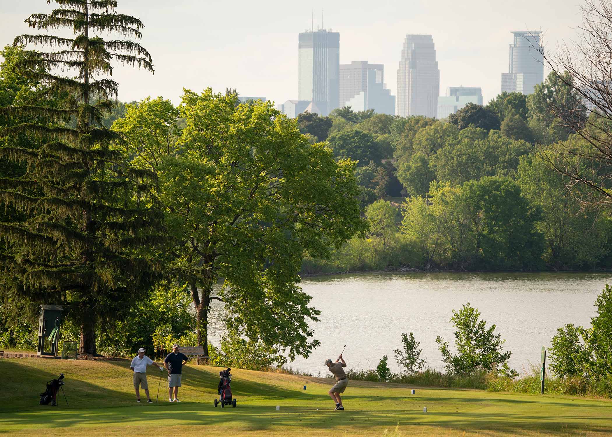 A golfer tees off on the 12th hole at Hiawatha Golf Course on July 8, 2021.