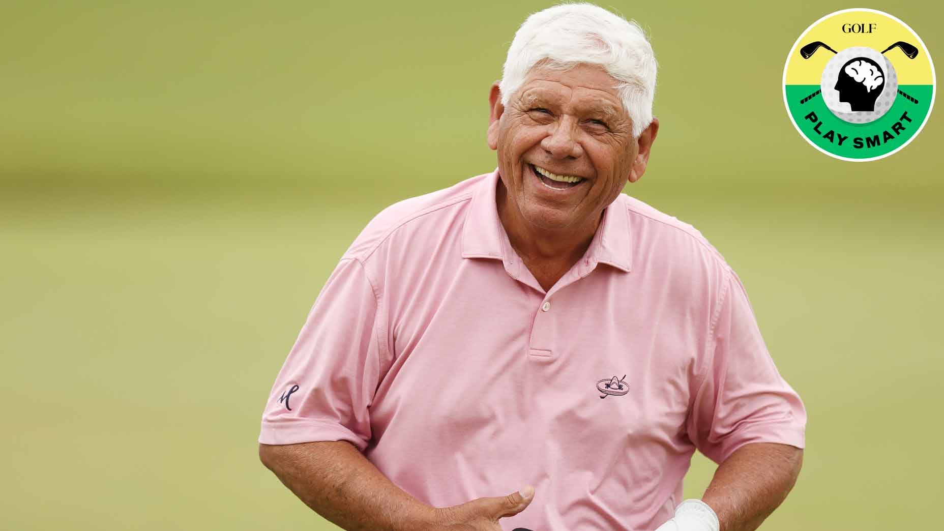 lee trevino laughs while wearing a pink shirt