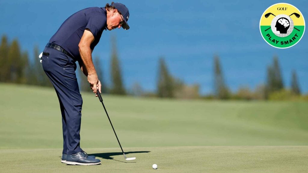 phil mickelson hits a putt during the 2022 sentry tournament of champions