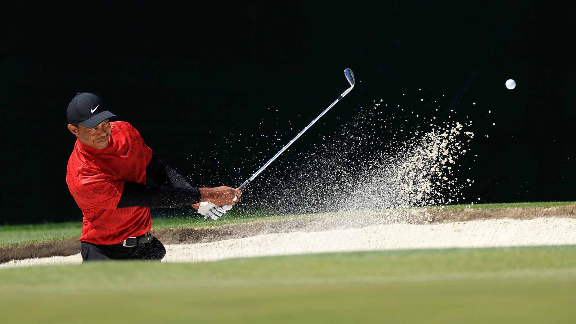 tiger woods hits bunker shot during final round of the 2022 masters at augusta national