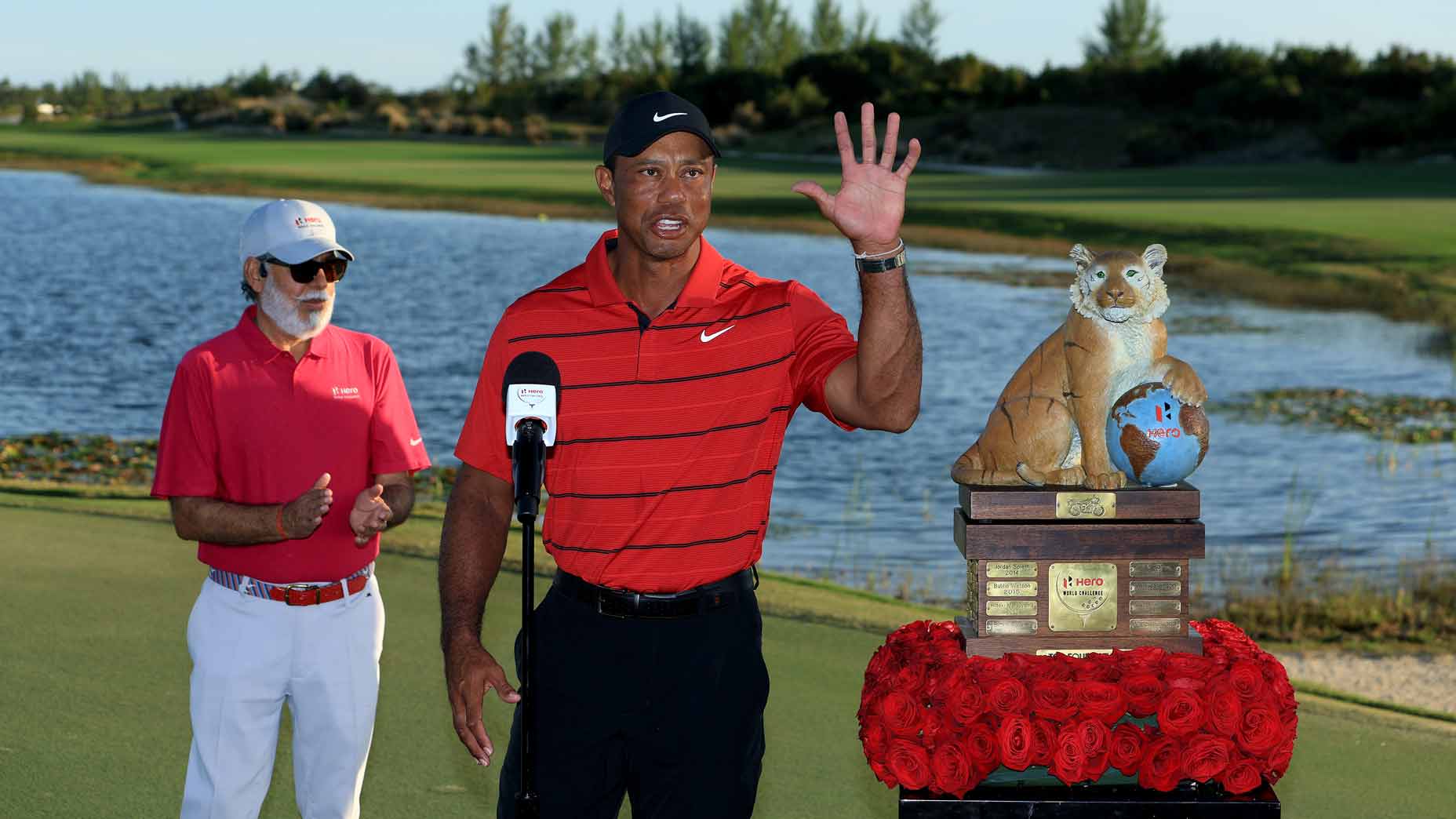 Tiger Woods waves to crowd during trophy presentation at 2023 Hero World Challenge