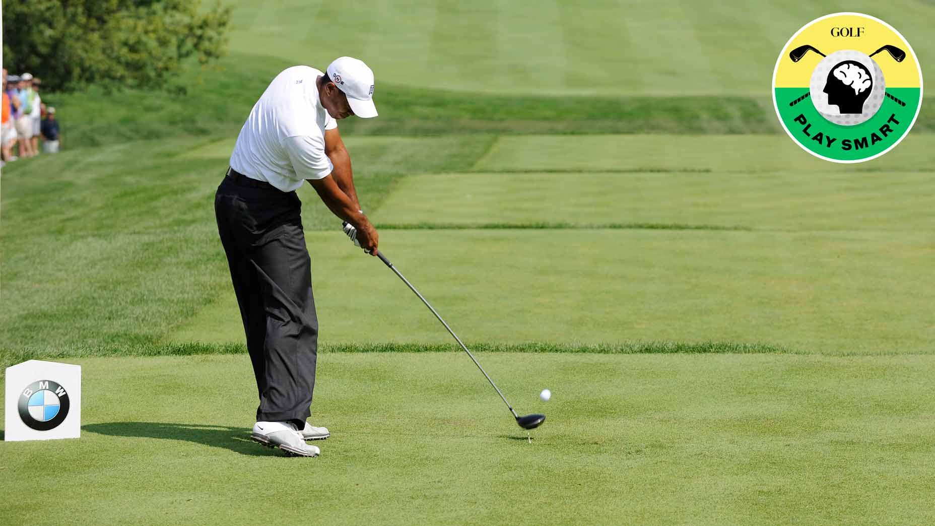 tiger woods hits driver off the tee box during the 2009 BMW Championship