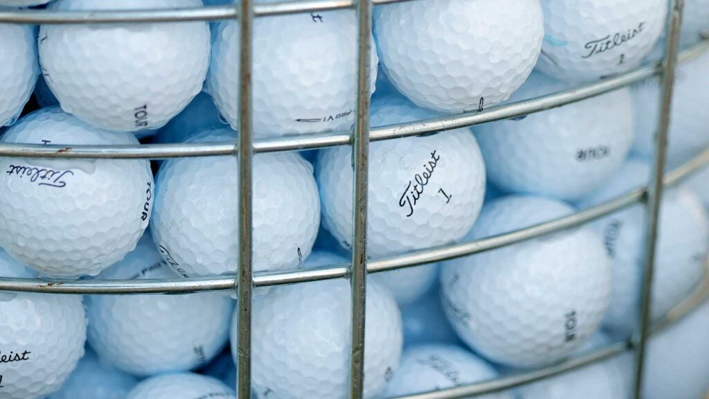 a bucket of titleist golf balls