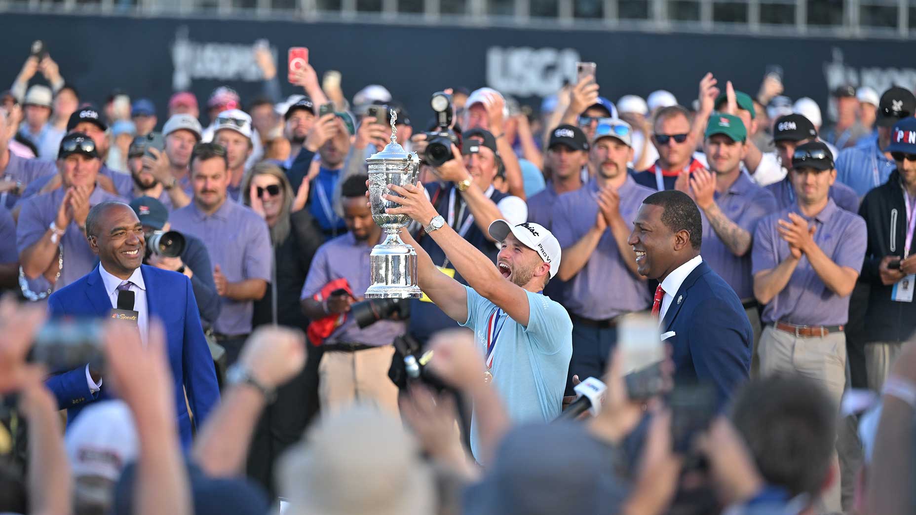 Wyndham Clark lifts the trophy on the 18th green after the final round of the 123rd U.S. Open Championship at The Los Angeles Country Club on June 18, 2023.