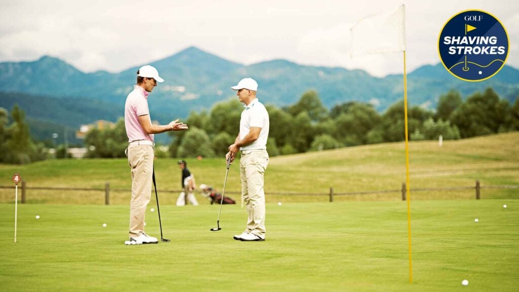 Two golfers talk on golf course