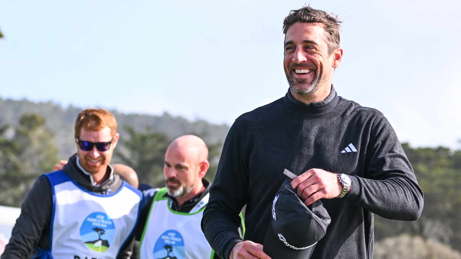 Aaron Rodgers smiles at Pebble Beach.