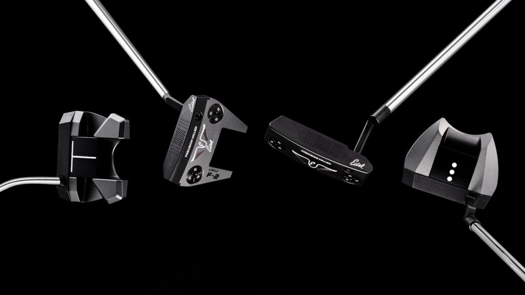 Four Edel Array putters against a black background