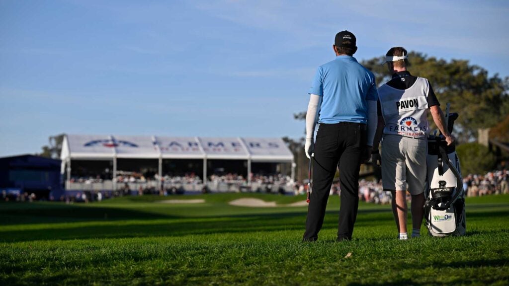 Matthieu Pavon talks with his caddie over a crucial shot at the 2024 Farmers Insurance Open
