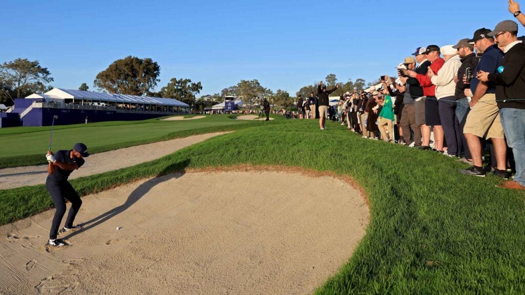Tony Finau of the United States plays his shot from the bunker on the 17th hole during the third round of the Farmers Insurance Open at Torrey Pines South Course on January 26, 2024 in La Jolla, California.