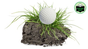 golf ball on grass clump