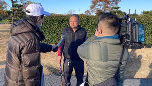 a golfer is interviewed at the All-Japan Park Golf Championship