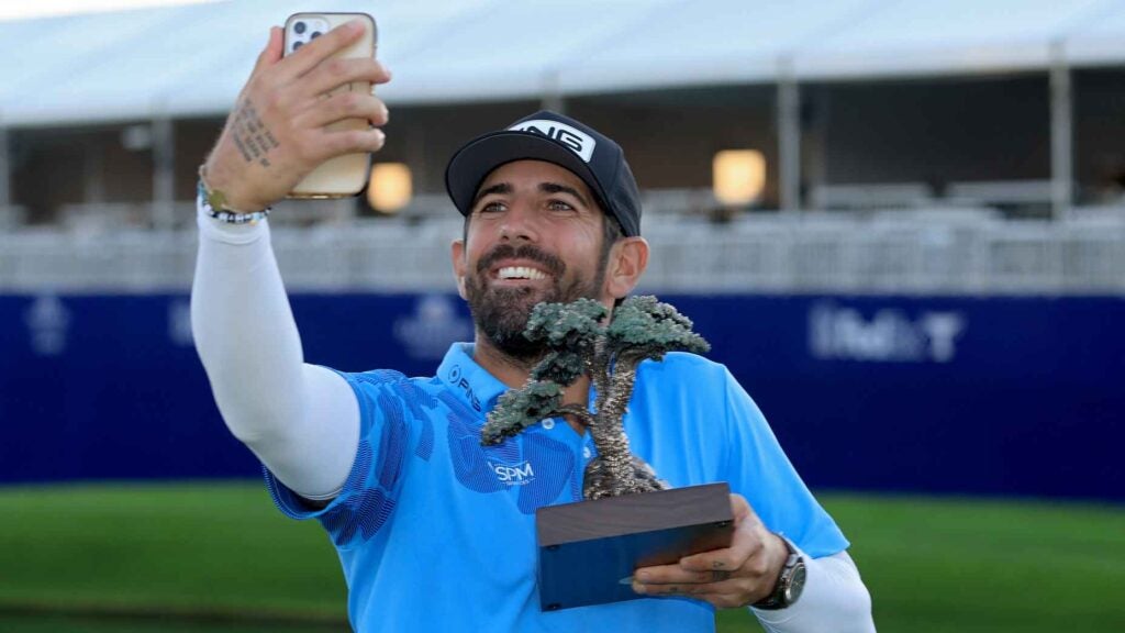 Matthieu Pavon of France poses with the trophy after winning the Farmers Insurance Open at Torrey Pines South Course on January 27, 2024 in La Jolla, California.