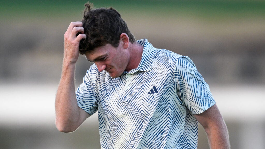 Nick Dunlap holding head after winning the American Express.