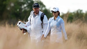 Rose Zhang of the United States and caddie Olly Brett walk the the second hole during the second round of the CME Group Tour Championship at Tiburon Golf Club on November 17, 2023 in Naples, Florida.
