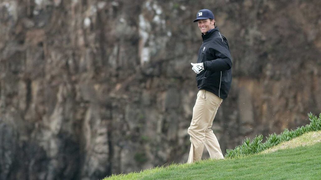 Tom Brady walks down a hill on the 8th hole at Pebble Beach Golf Links during the third round of the 2014 AT&T Pebble Beach Pro-Am.
