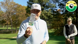 jonathan yarwood holds up an empty water bottle