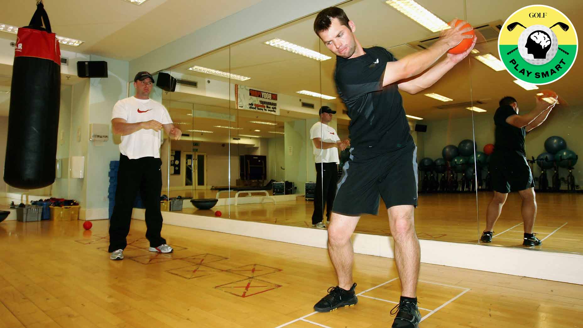 paul casey trains with a medicine ball in a training studio in 2005