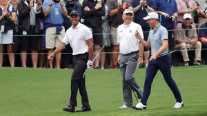 Tiger Woods, Fred Couples and Justin Thomas walk on the 16th hole during a practice round prior to the 2022 Masters at Augusta National