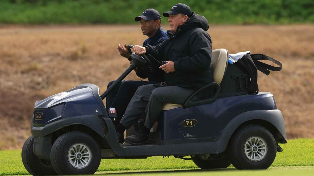 Tiger Woods of the United States is driven from the course by a rules official after withdrawing from the tournament due to illness on the sixth hole during the second round of The Genesis Invitational at Riviera Country Club on February 16, 2024 in Pacific Palisades, California.
