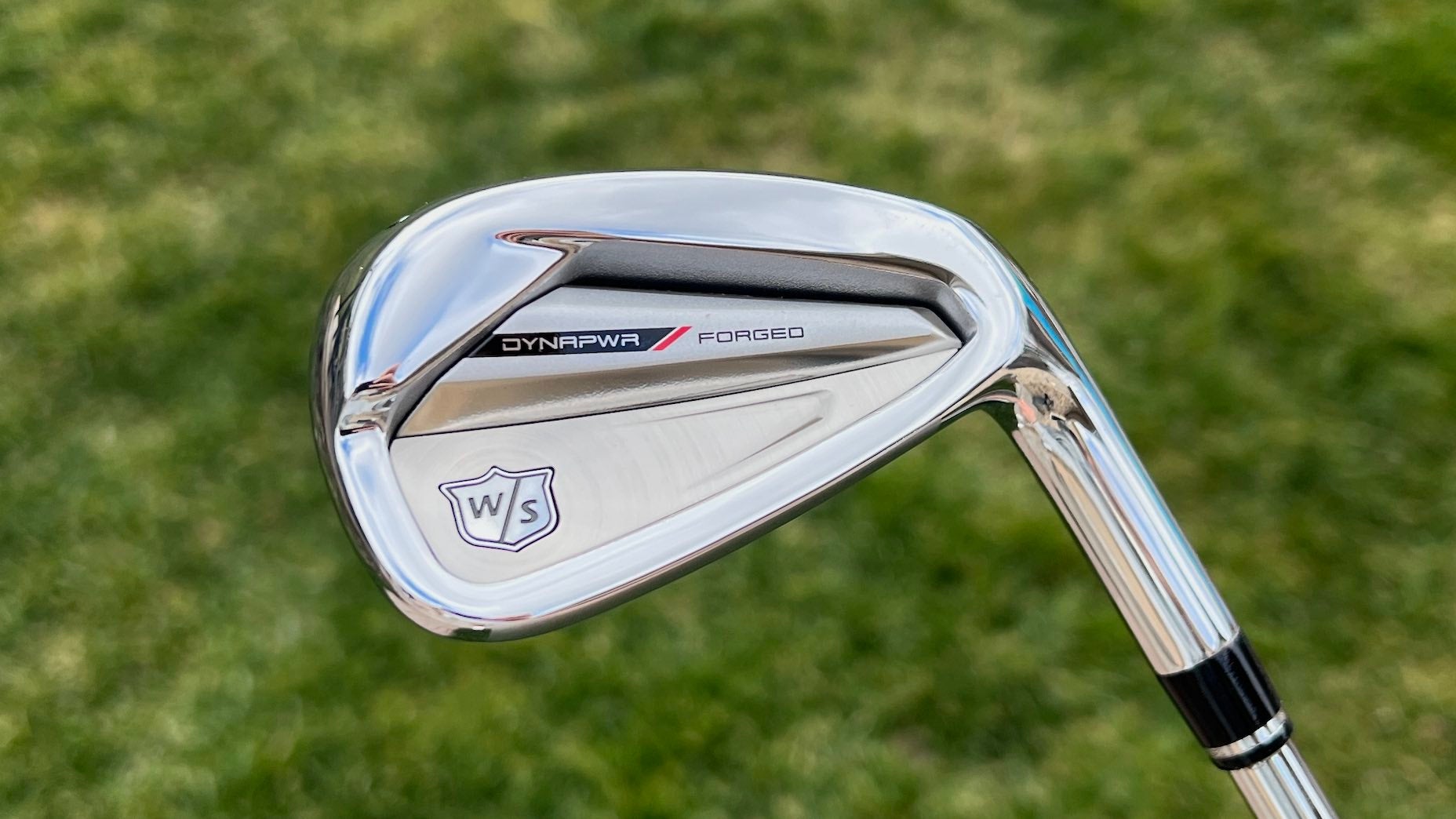 A single Wilson Dynapower forged iron pictured against a grass background