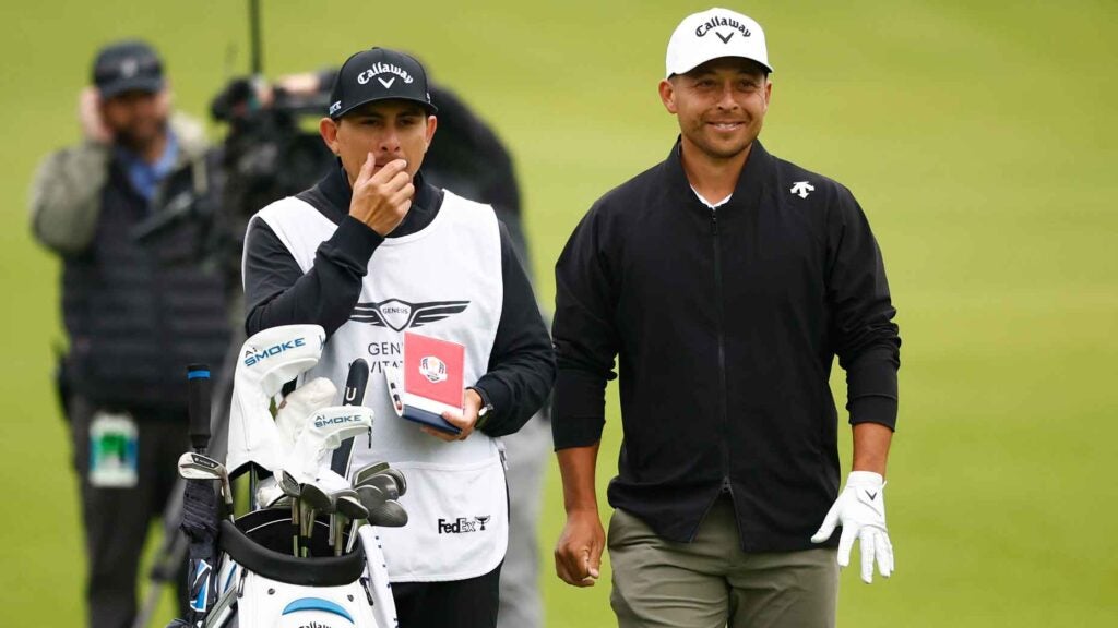 Xander Schauffele of the United States and caddie Austin Kaiser prepare to play his shot on the second hole during the third round of The Genesis Invitational at Riviera Country Club on February 17, 2024 in Pacific Palisades, California.