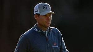 Adam Schenk of the United States walks from the second tee during the first round of The Genesis Invitational