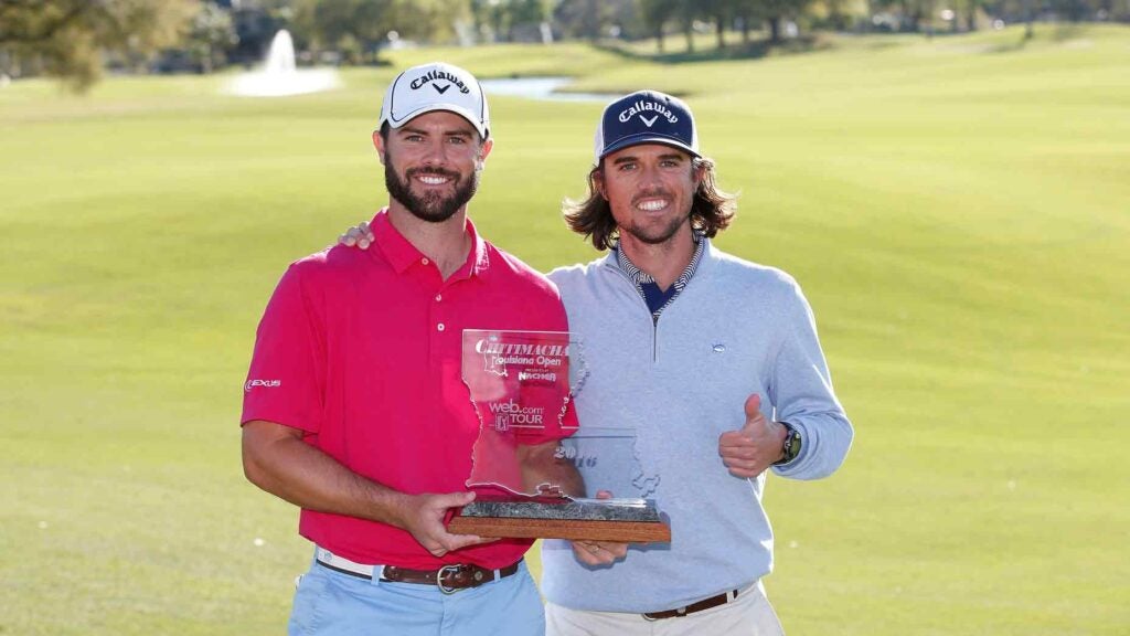 Wesley Bryan poses with his brother and caddie, George Bryan, after winning the 2023 Louisiana Open