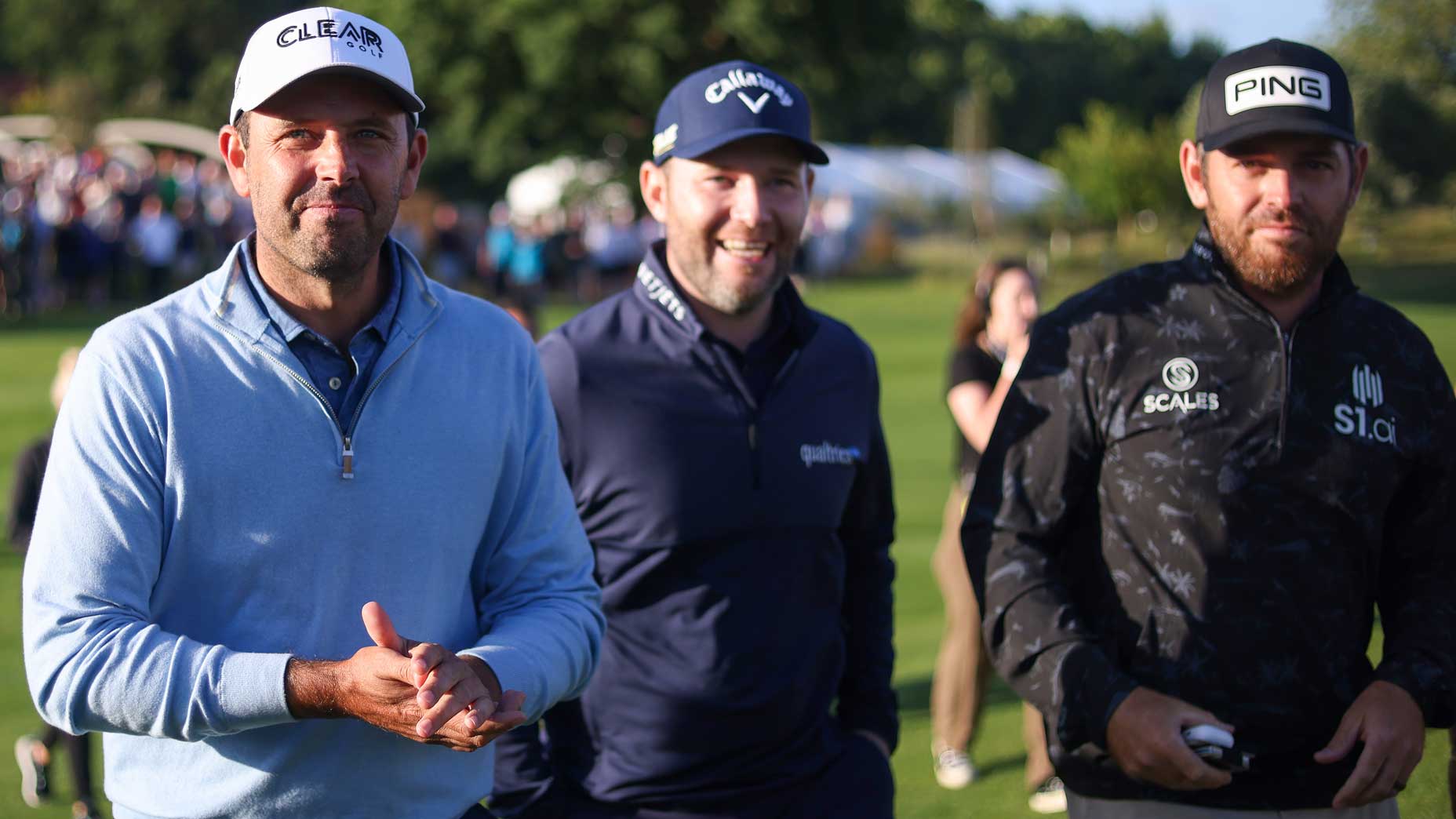 Individual winner Charl Schwartzel walks alongside teammates Branden Grace and Louis Oosthuizen of Stinger GC during day three of the 2022 LIV Golf Invitational - London event.