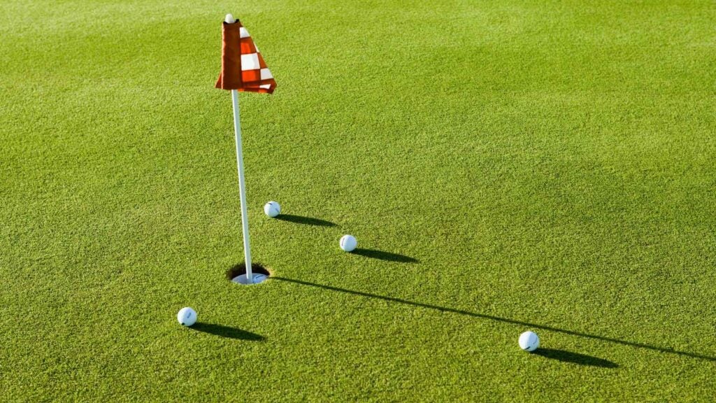 golf balls on a practice putting green