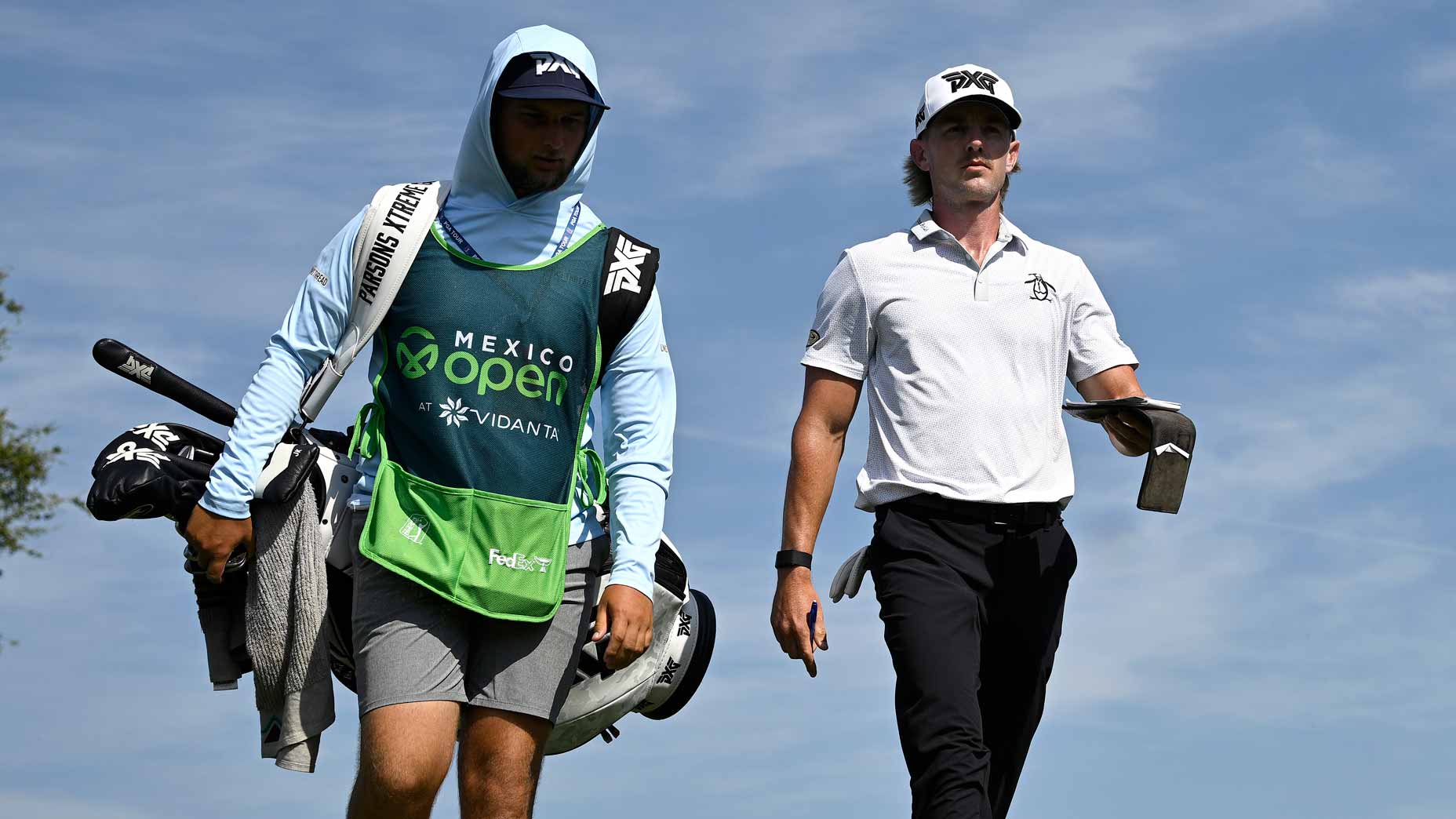 Jake Knapp walks with his caddie during the 2024 Mexico Open
