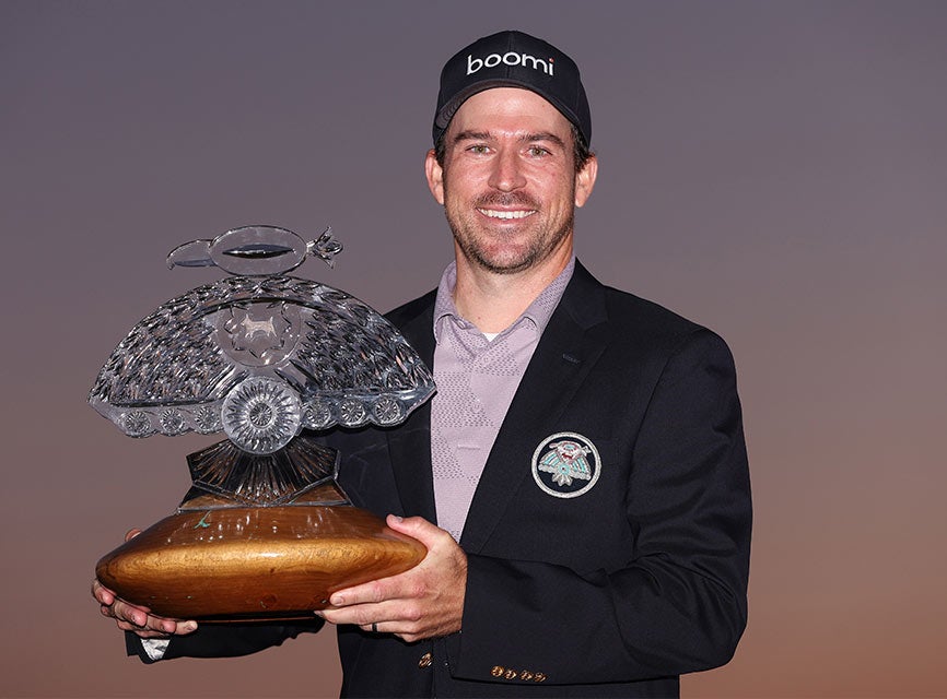 SCOTTSDALE, ARIZONA - FEBRUARY 11: Nick Taylor of Canada celebrates with the trophy after winning in a two-hole playoff during the final round of the WM Phoenix Open at TPC Scottsdale on February 11, 2024 in Scottsdale, Arizona. (Photo by Orlando Ramirez/Getty Images)