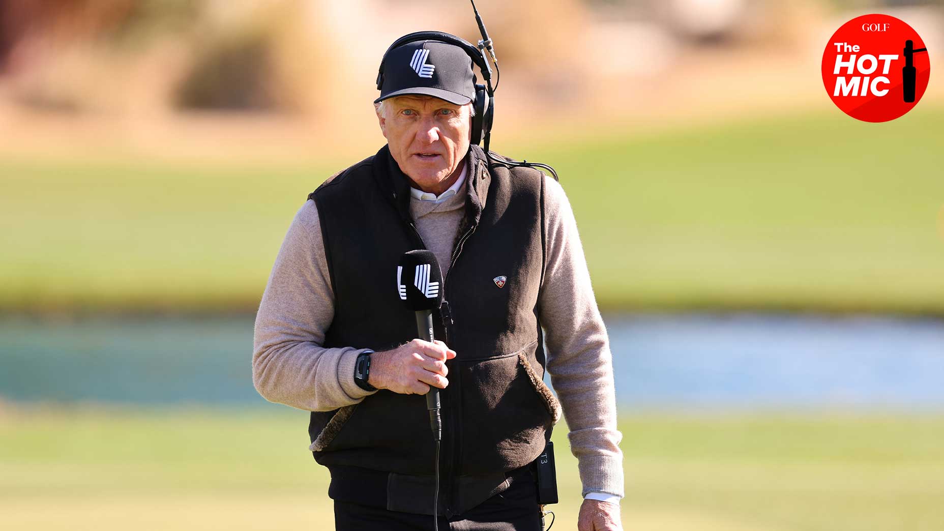 greg norman speaks into microphone at LIV Vegas event in vest