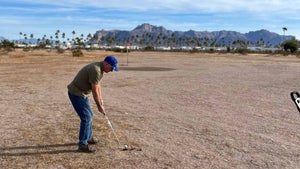A golfer plays at Snakehole Golf Course in Arizona