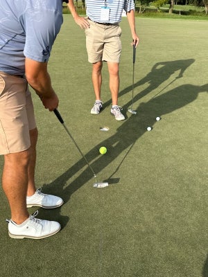 Joe Hallett attempting to make a tennis ball to help dial in his putting stroke