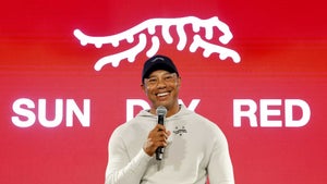 Tiger Woods speaks to the crowd as he launches his new apparel line.
